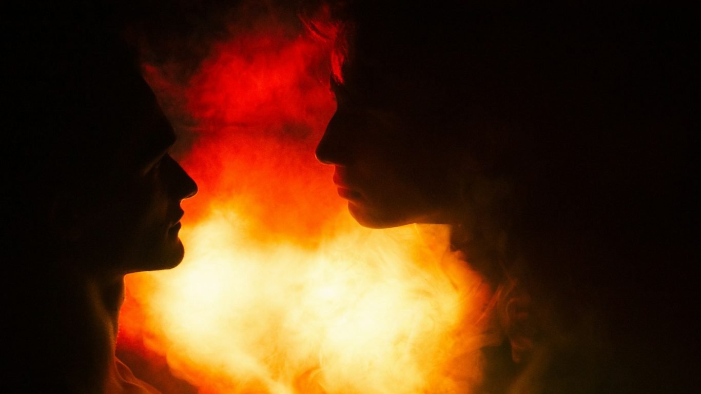 a couple of people standing next to each other